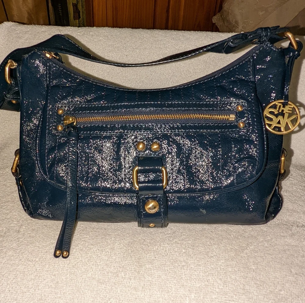 The  Sak navy blue patent leather hobo bag.